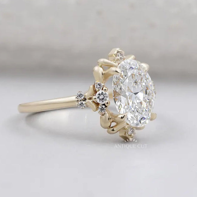Oval diamond ring with floral halo yellow gold