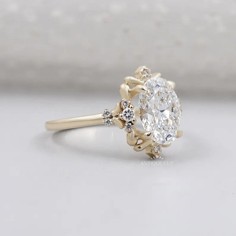 Oval diamond ring with floral halo yellow gold