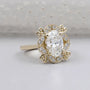 Yellow gold oval halo engagement ring close-up