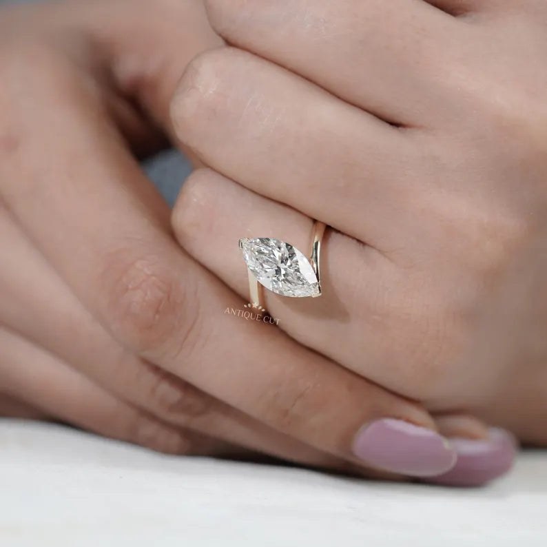 Luxury marquise engagement ring with bypass band
