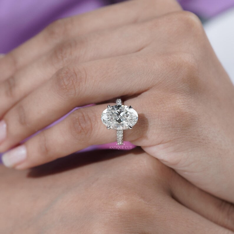 Sparkling pave band oval diamond ring