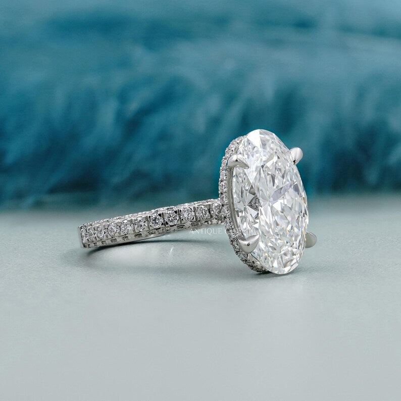 Oval diamond ring with pave band design