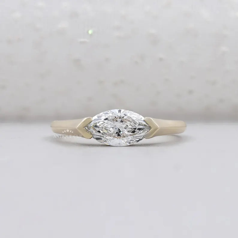 Marquise cut engagement ring east west setting