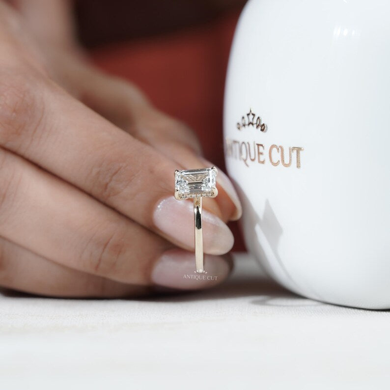 Minimalist emerald engagement ring