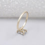 Emerald cut ring with subtle halo detail