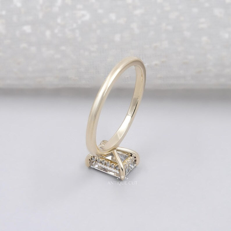 Emerald cut ring with subtle halo detail