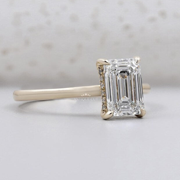 Yellow gold emerald diamond ring close-up