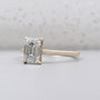 Hidden halo ring emerald cut side view