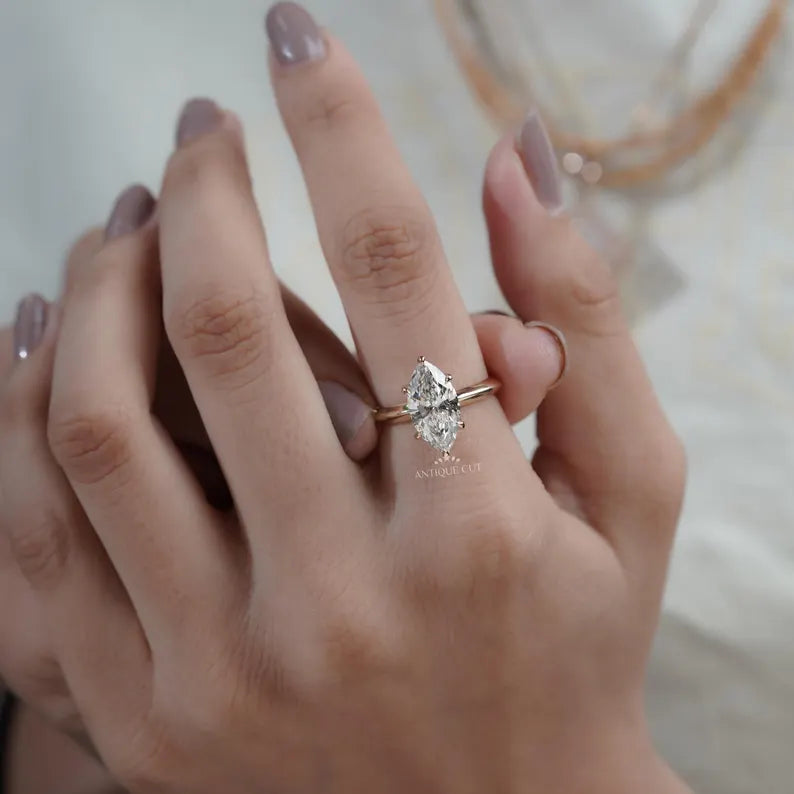 marquise solitaire ring in yellow gold band