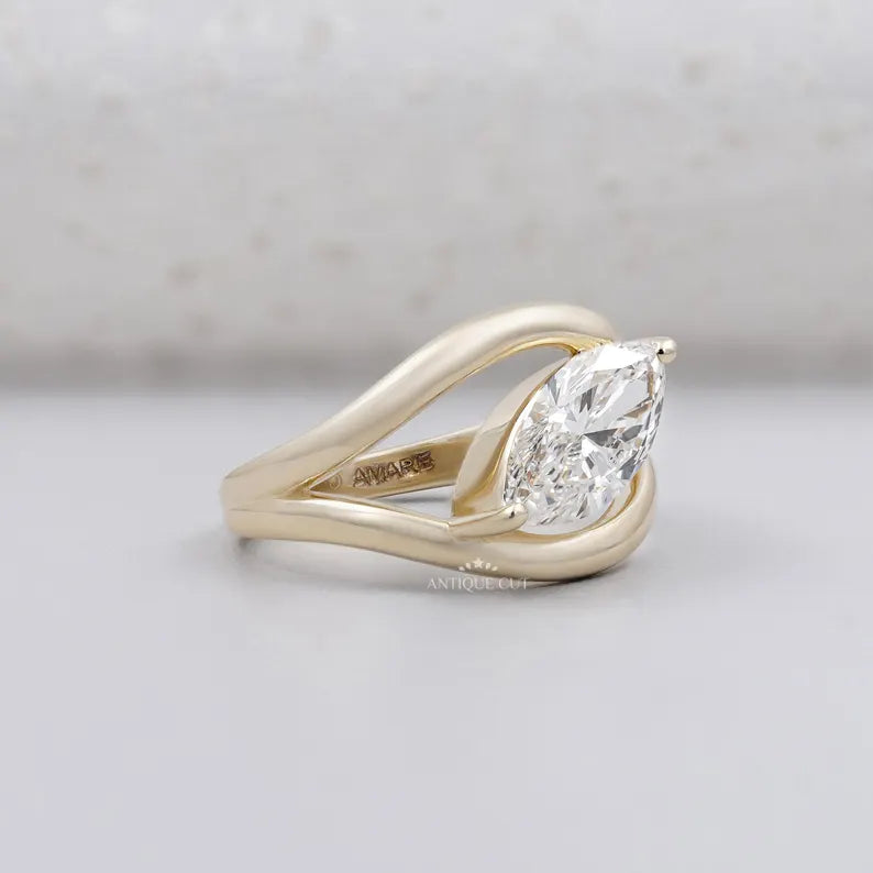 Yellow gold marquise solitaire diamond engagement ring close up