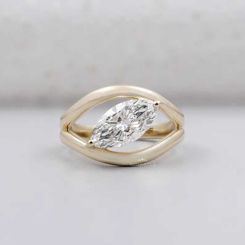 Marquise cut lab grown diamond engagement ring with sculptural band