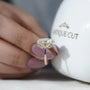 Oval diamond halo ring side view