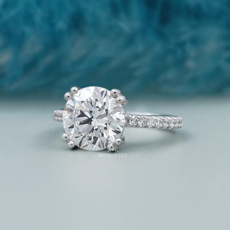 double claw prong round cut diamond ring