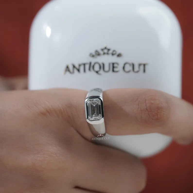 emerald and diamond solitaire engagement ring