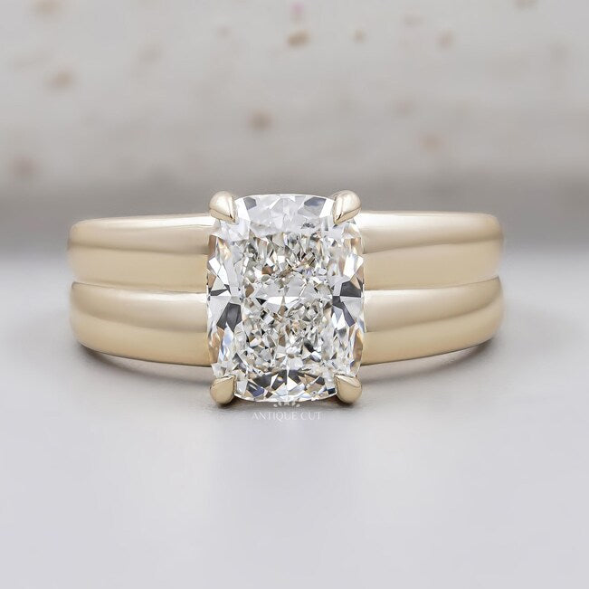 Cushion cut engagement ring in yellow gold