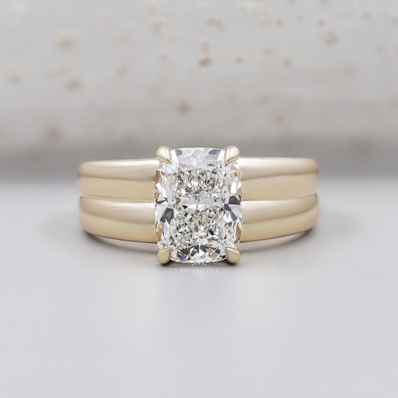 Cushion cut engagement ring in yellow gold