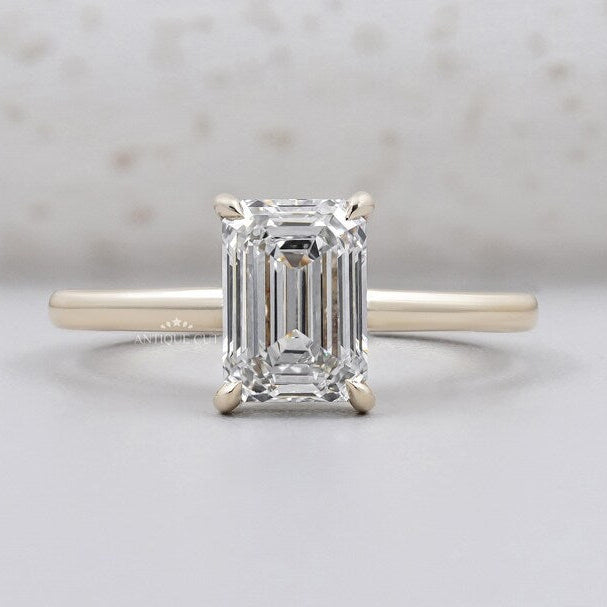Emerald cut engagement ring with hidden halo