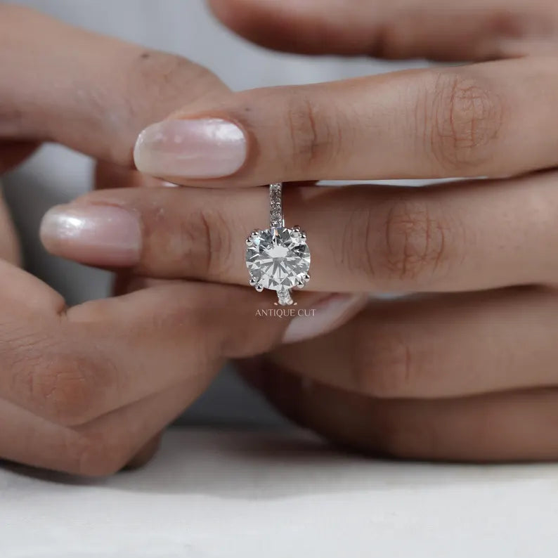 round diamond ring with double claw prongs