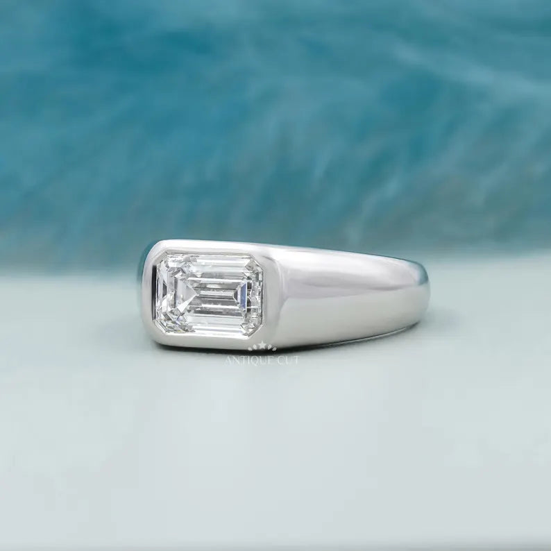 white gold east west emerald engagement ring