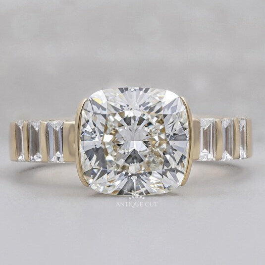 East west cushion cut engagement ring yellow gold