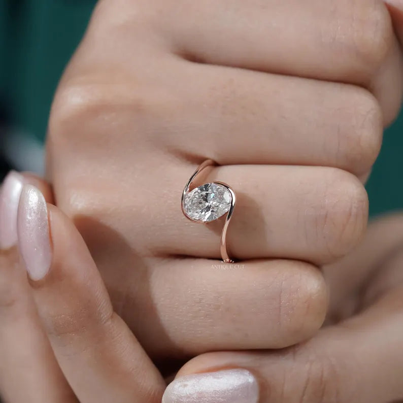 rose gold oval diamond ring half bezel