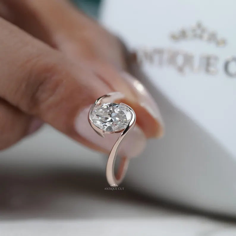 oval solitaire ring with half bezel