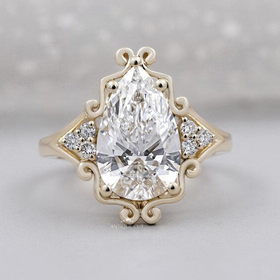 Vintage inspired halo pear cut diamond ring