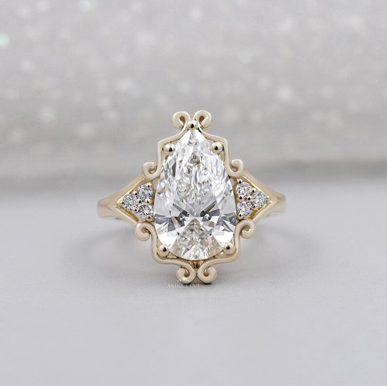 Vintage inspired halo pear cut diamond ring