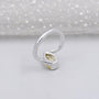 Pear shaped yellow diamond ring on hand