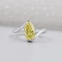 Pear shaped yellow diamond ring in white gold, top view