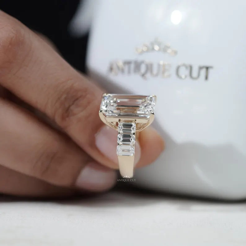 Close-up of emerald cut diamond with tapered side stones