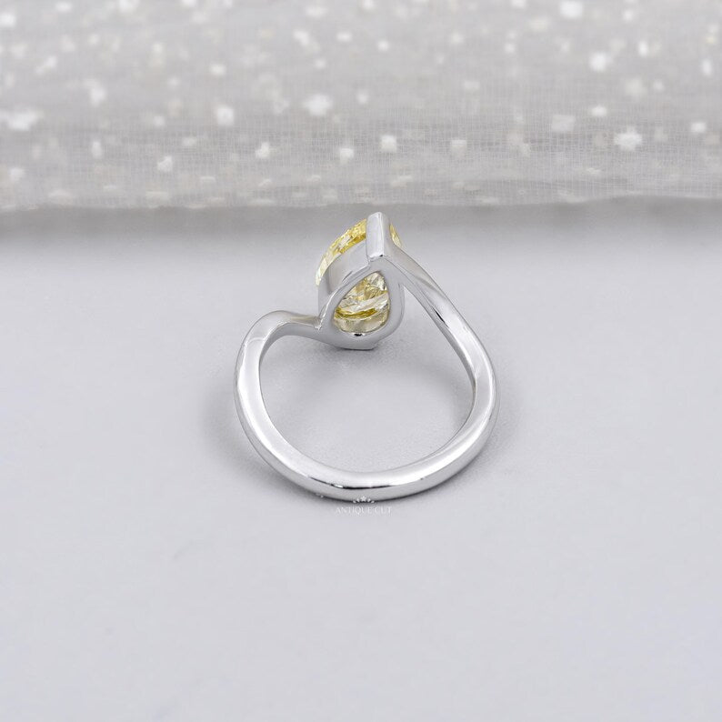 Elegant bypass wedding ring with pear yellow diamond