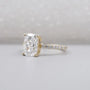 Cushion cut engagement ring with pave band