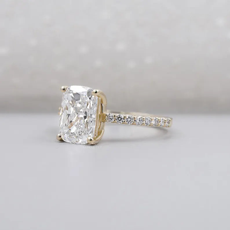 Cushion cut engagement ring with pave band