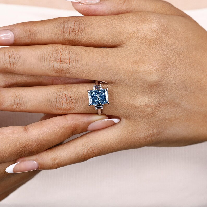 Fancy Blue Radiant Cut Diamond Ring With Trapezoid Side Stones