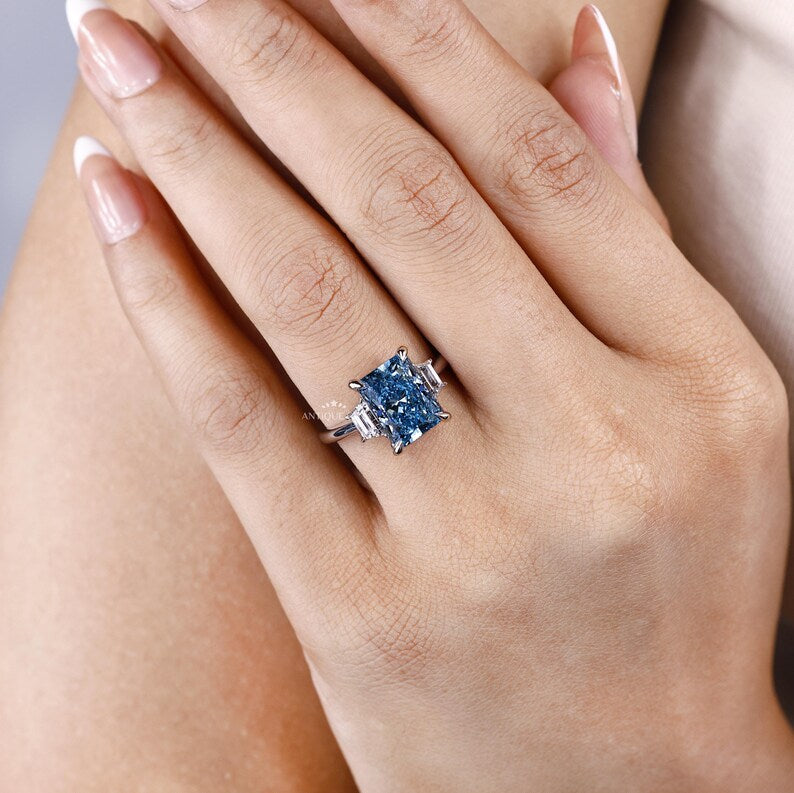 Fancy Blue Radiant Cut Diamond Ring With Trapezoid Side Stones
