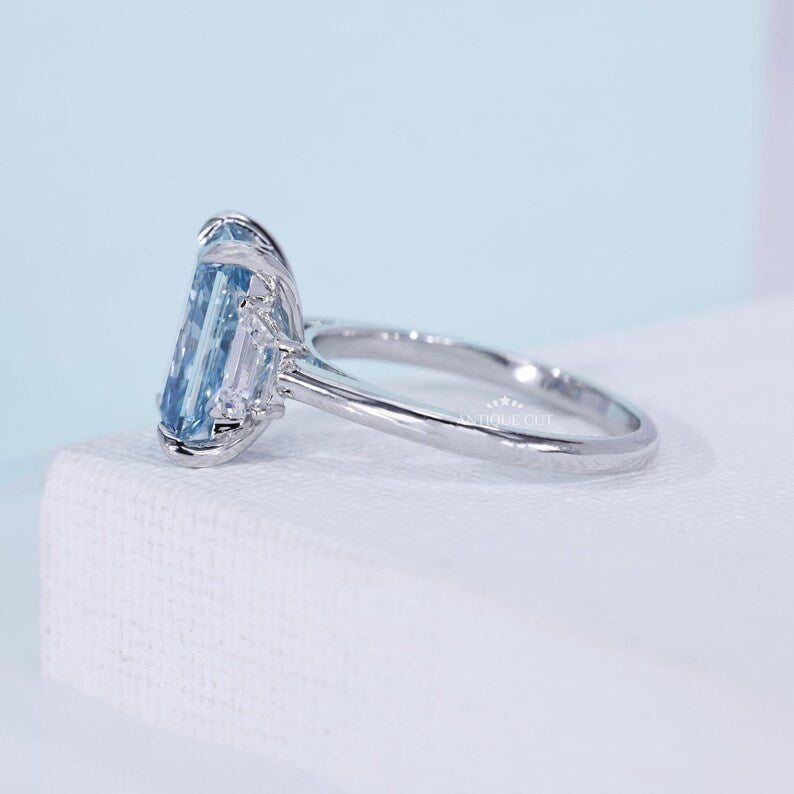 Fancy Blue Radiant Cut Diamond Ring With Trapezoid Side Stones