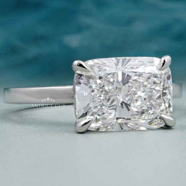 Cushion cut East West diamond solitaire ring