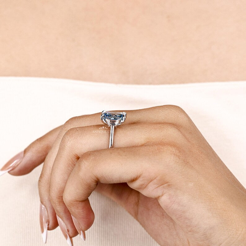 Fancy Blue Radiant Cut Diamond Ring With Trapezoid Side Stones