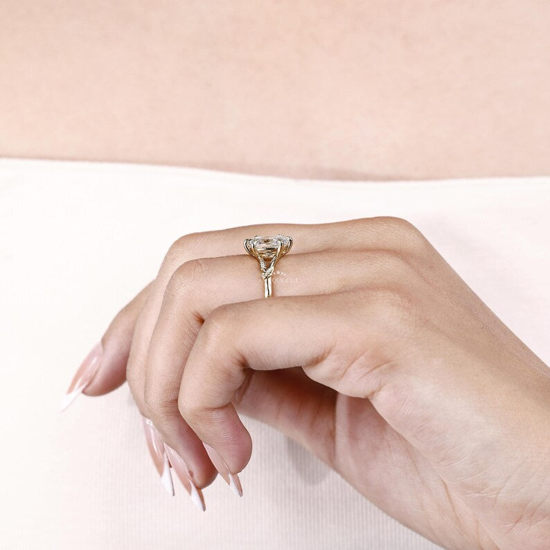 Yellow gold vine engagement ring with 6 prong claw setting