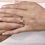 Women’s oval diamond engagement ring with unique vine band