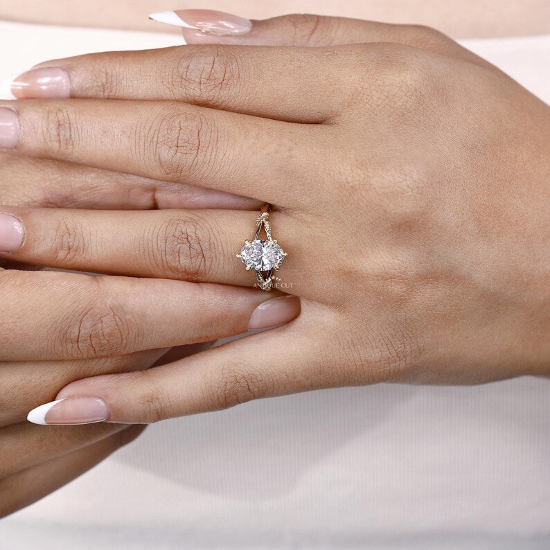 Women’s oval diamond engagement ring with unique vine band