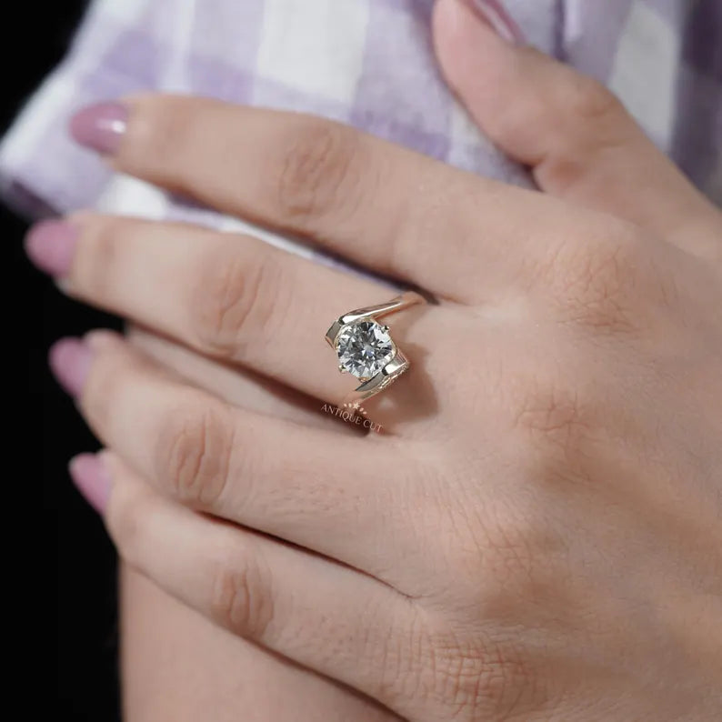 Polished yellow gold bypass ring with hidden diamond halo