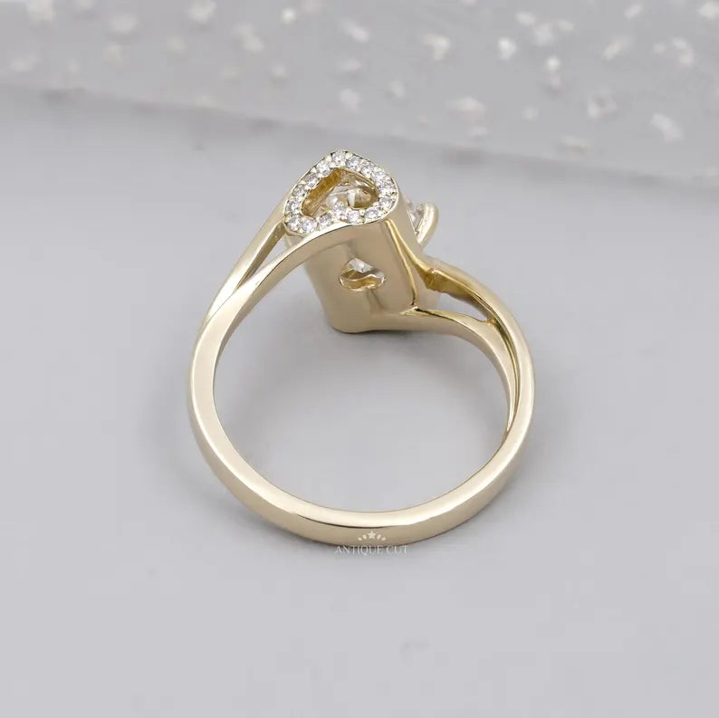 Front view of round diamond bypass engagement ring