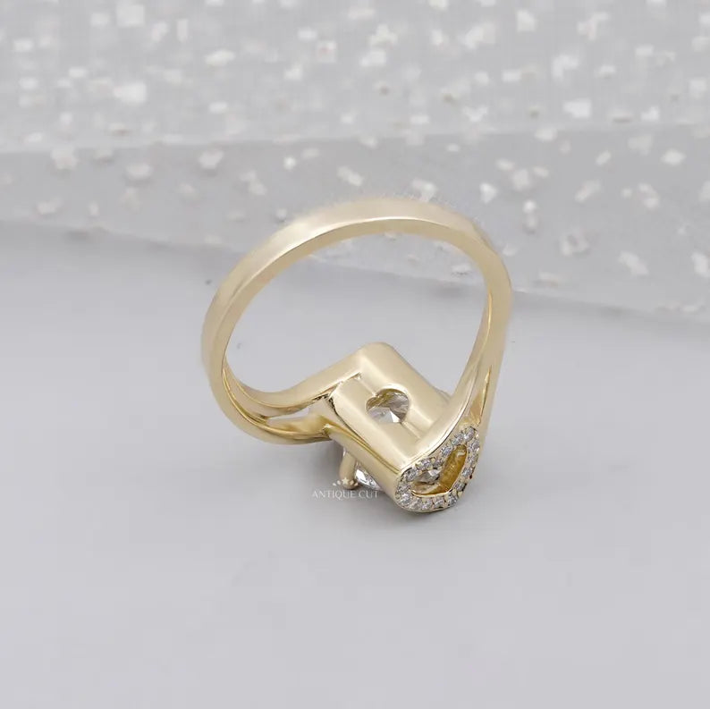 Side view of yellow gold engagement ring with hidden halo