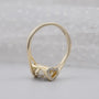 Yellow gold split shank proposal ring with round center diamond
