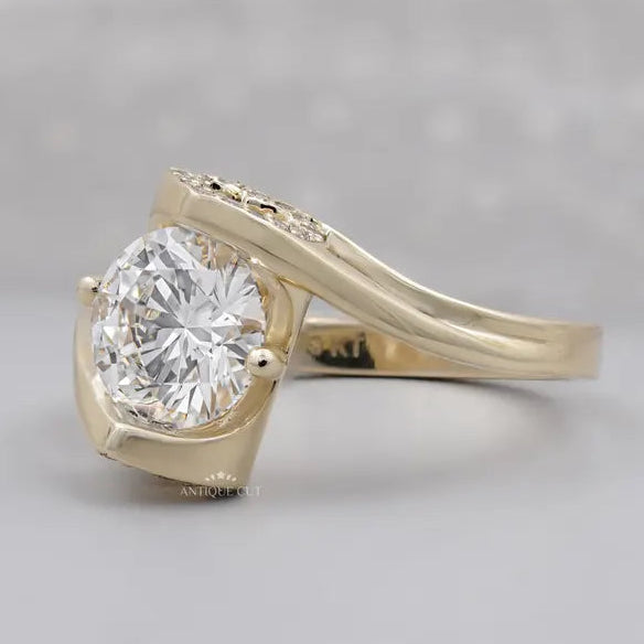 Yellow gold round diamond ring shown on a woman’s hand
