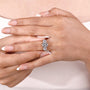 Lab grown oval diamond ring with marquise cut side stone design