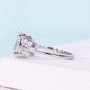 IGI certified oval cut diamond engagement ring with unique side accents