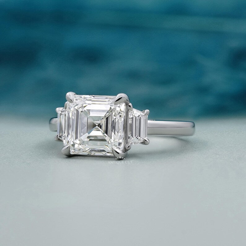 White Gold Square Emerald Diamond Engagement Ring with Step Cut Side Diamonds